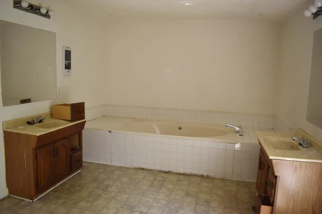 a view of a bathroom with a glass door and shower