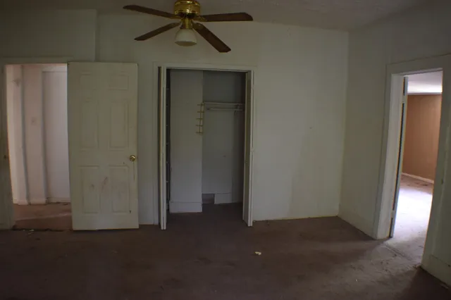 a view of an empty room with a door