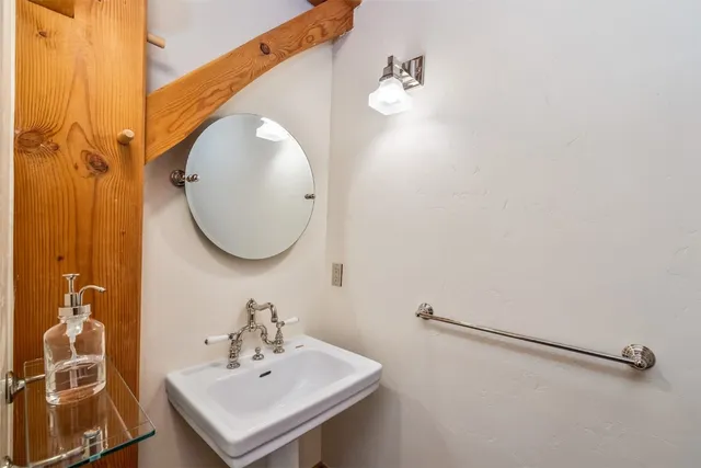 a bathroom with a sink and mirror