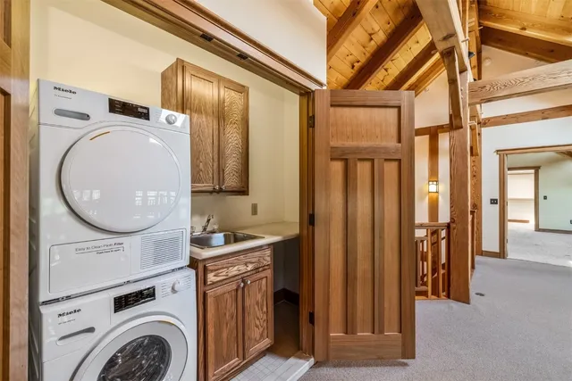 a view of a hallway with washer and dryer