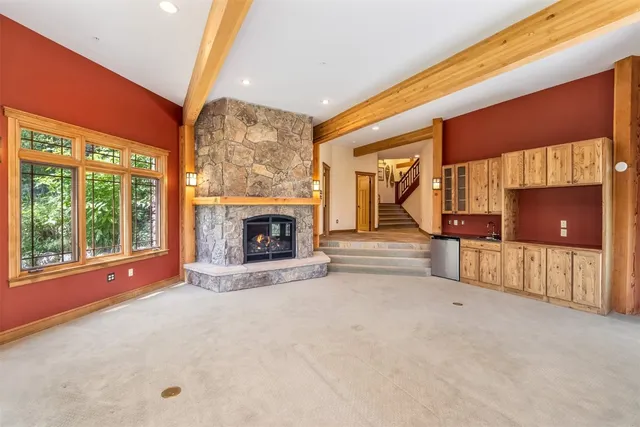a view of an empty room with a fireplace