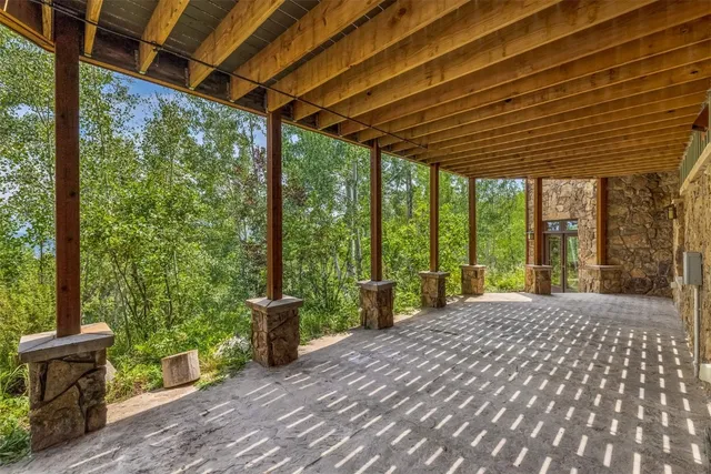 a view of a porch with wooden floor