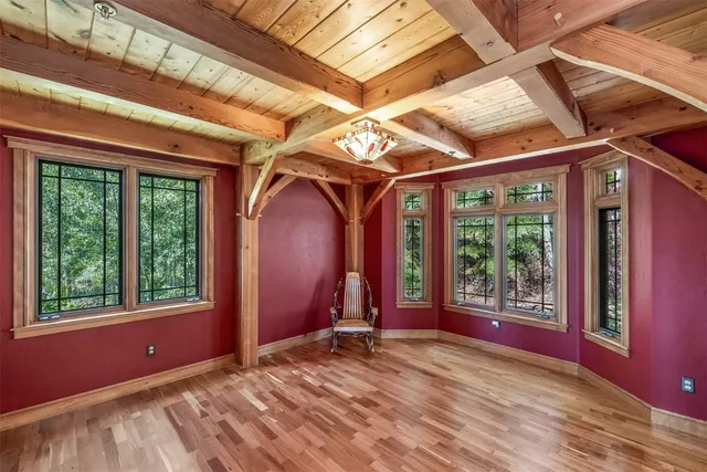 a view of a room with wooden floor and balcony