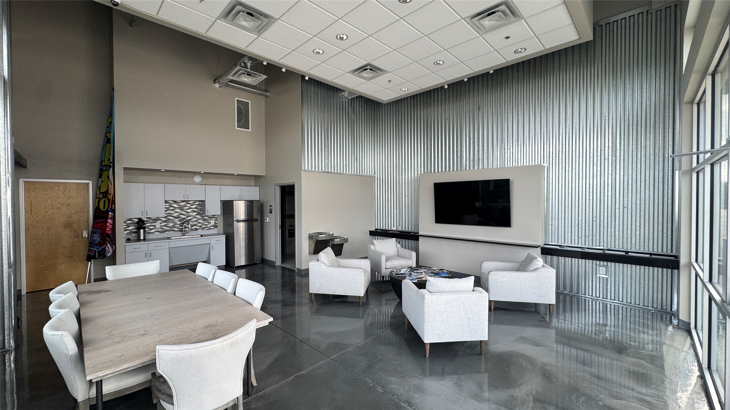 1009 Ranch Road 620 North, Unit 401 Lakeway, TX 78734 - Photo 15 of 15 A spacious common area with a modern kitchen and comfortable lounge seating.