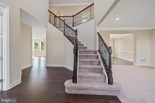a kitchen with stainless steel appliances granite countertop white cabinets and sink