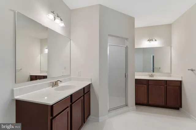 a bathroom with a toilet a sink and shower