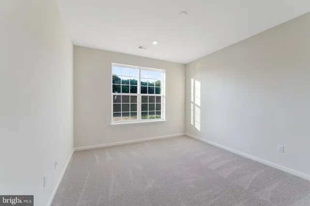 a bathroom with a double vanity sink and mirror