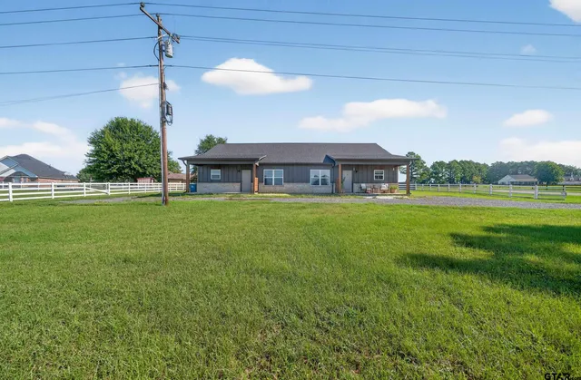 a view of a house with a big yard