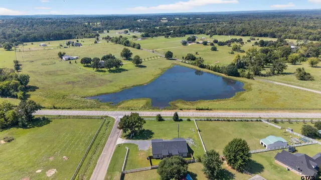 an aerial view of a house with outdoor space