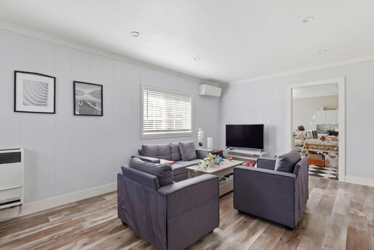 83 North King Road San Jose, CA 95116 - Photo 14 of 51 a living room with furniture and a flat screen tv