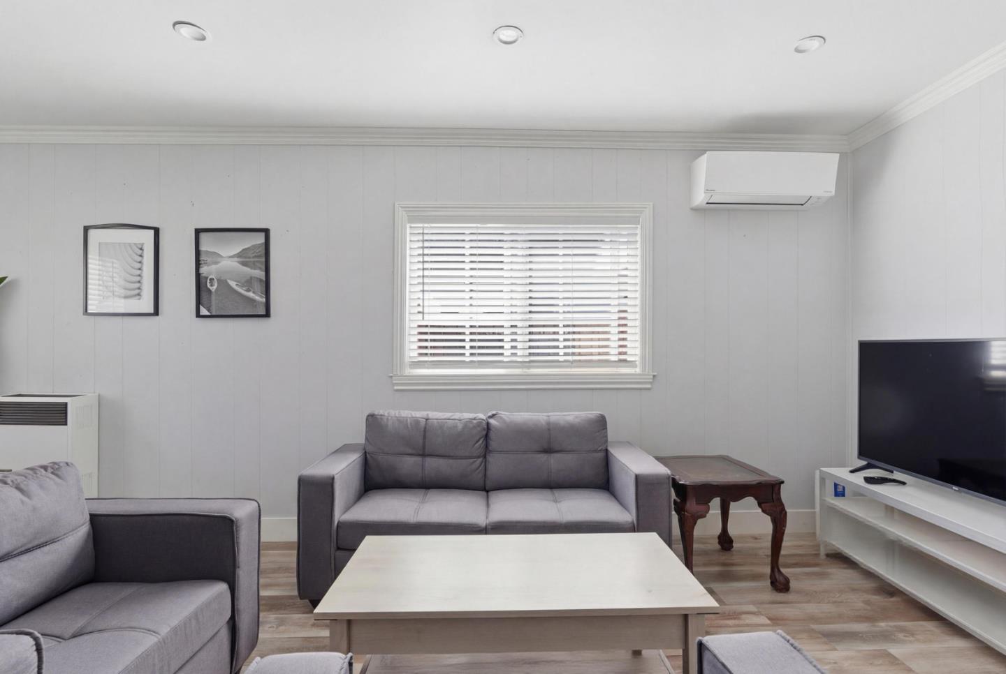 83 North King Road San Jose, CA 95116 - Photo 15 of 51 a living room with furniture and a flat screen tv