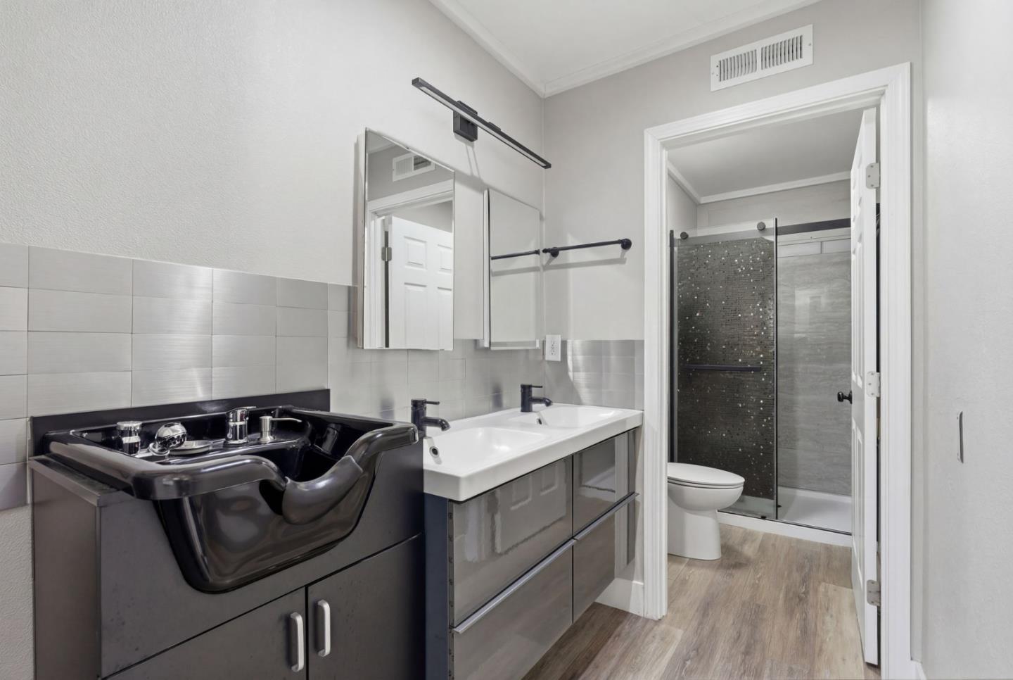 83 North King Road San Jose, CA 95116 - Photo 24 of 51 a bathroom with a sink toilet and shower