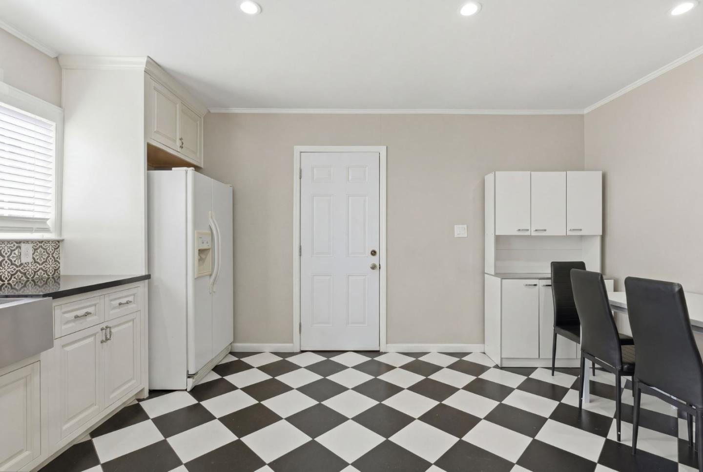 83 North King Road San Jose, CA 95116 - Photo 25 of 51 a view of a kitchen with black appliances and cabinets