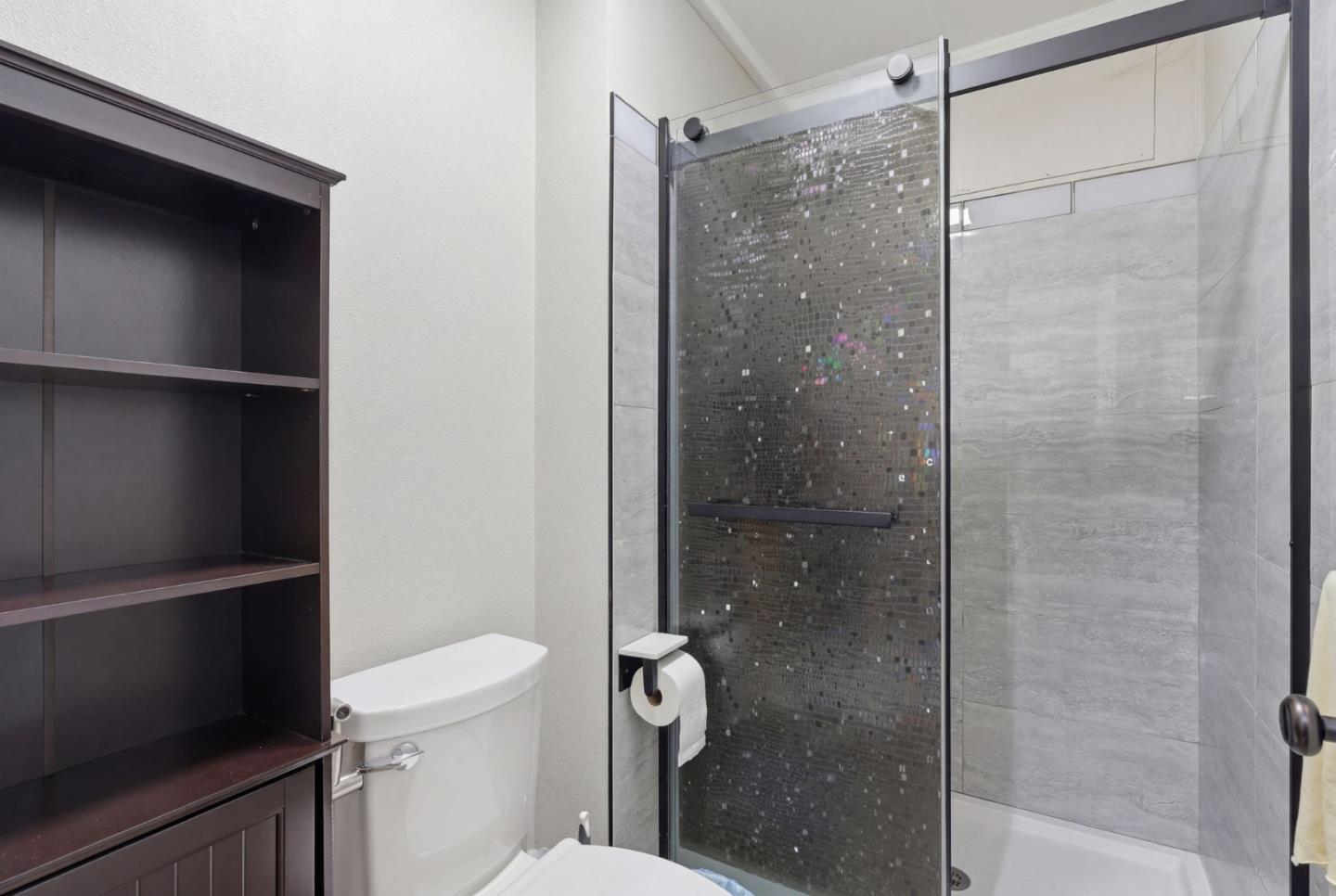 83 North King Road San Jose, CA 95116 - Photo 26 of 51 a bathroom with a shower a toilet and a sink
