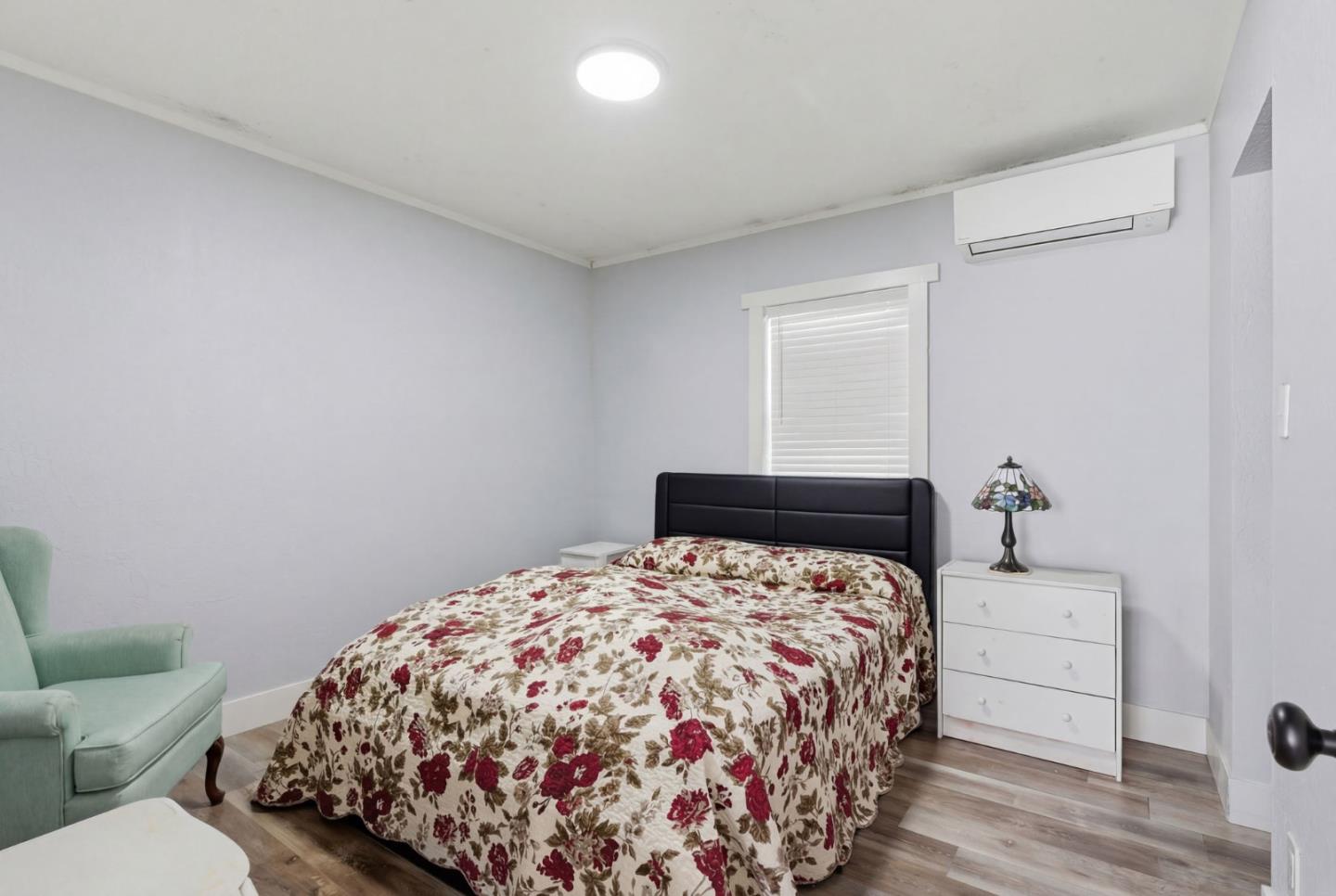 83 North King Road San Jose, CA 95116 - Photo 28 of 51 a bedroom with a bed and a window