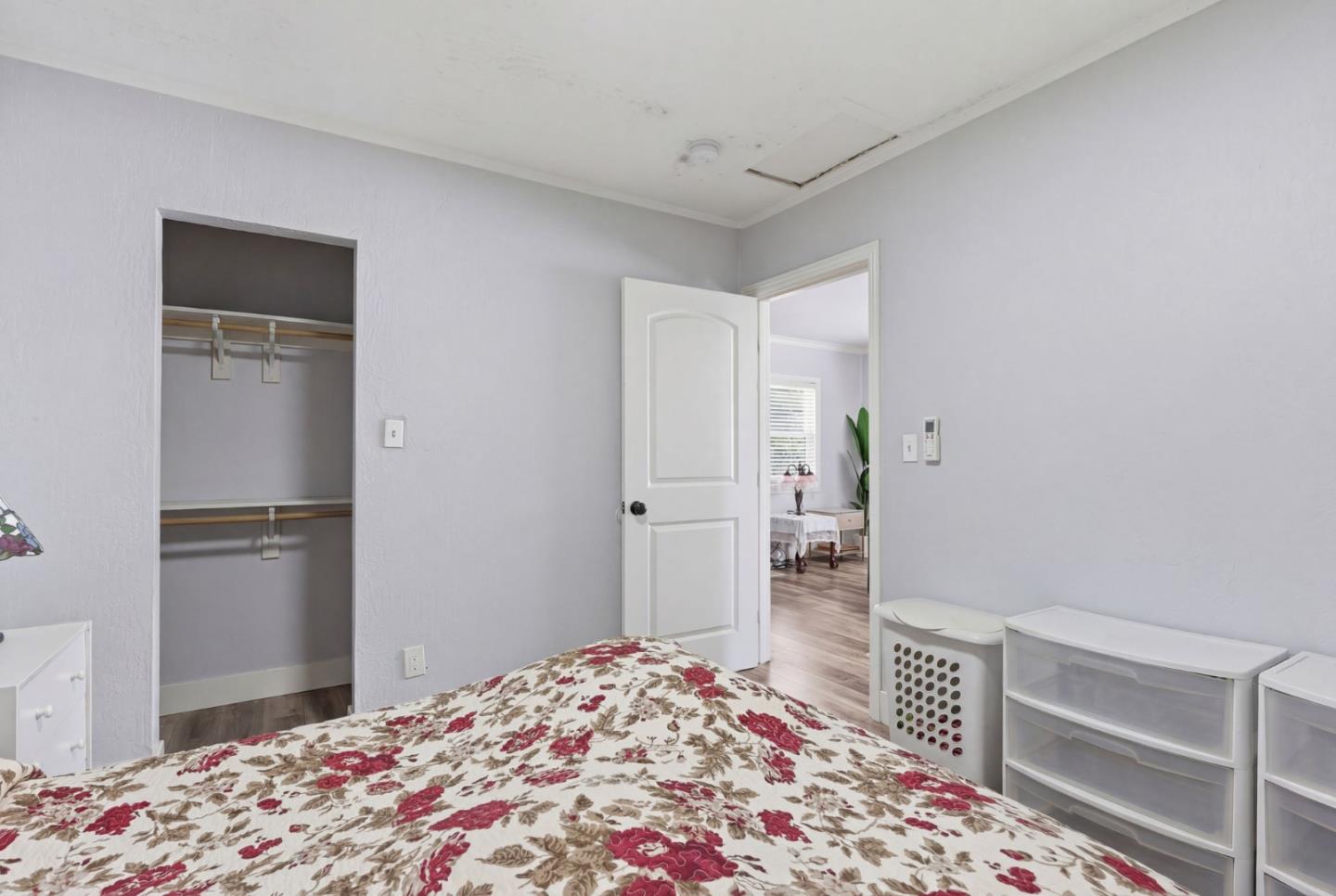 83 North King Road San Jose, CA 95116 - Photo 29 of 51 a bedroom with a bed and a window