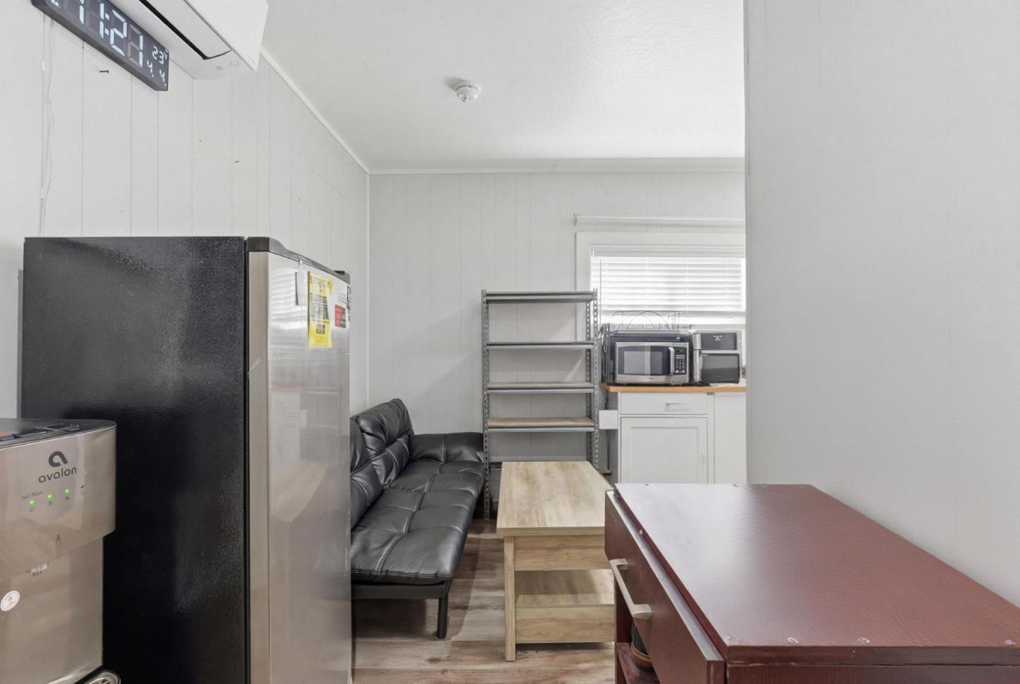 83 North King Road San Jose, CA 95116 - Photo 32 of 51 a kitchen with kitchen island a counter top space and appliances