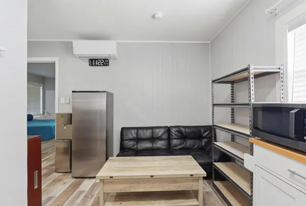 a kitchen with a refrigerator and a sink