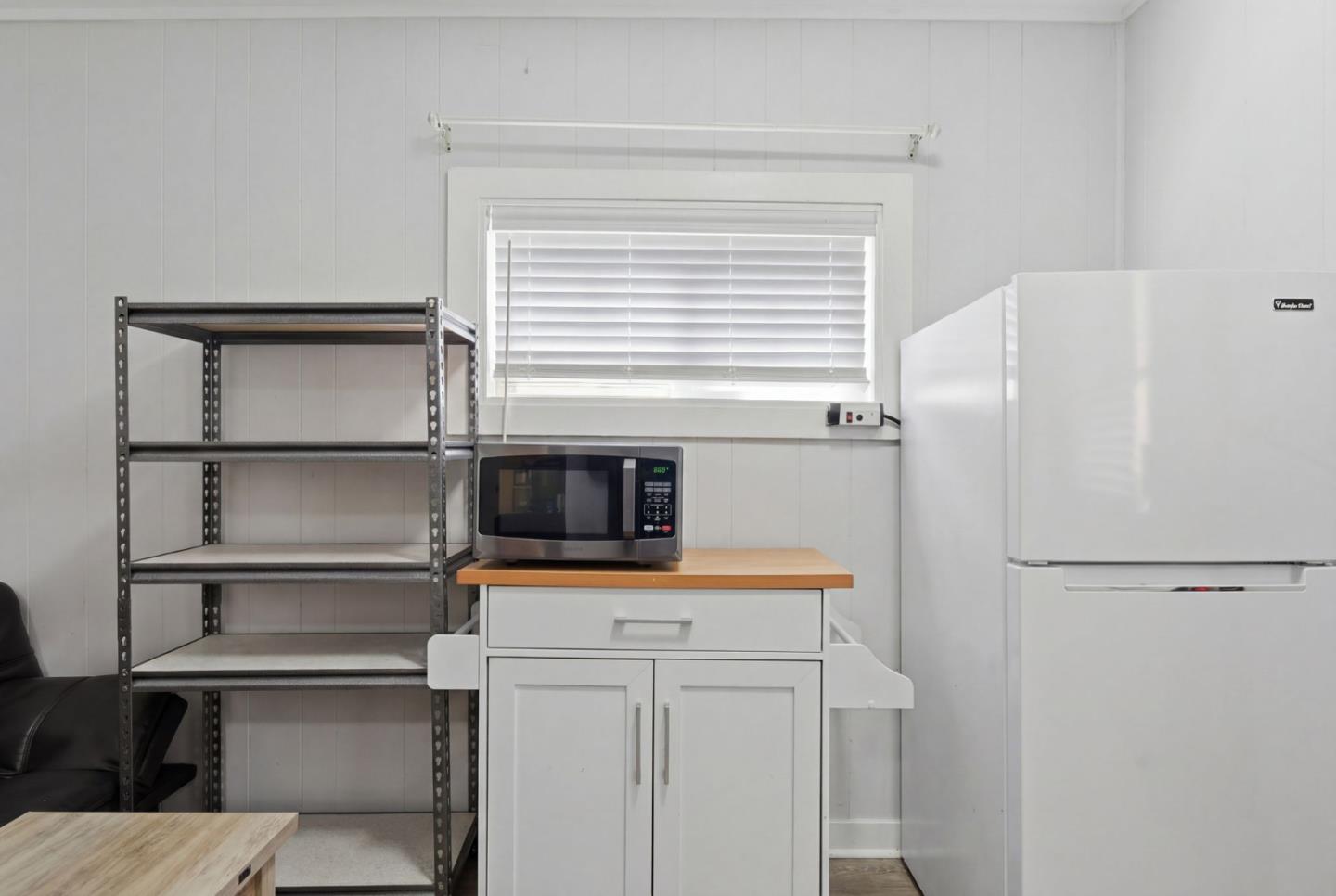 83 North King Road San Jose, CA 95116 - Photo 38 of 51 a kitchen with a refrigerator and a stove