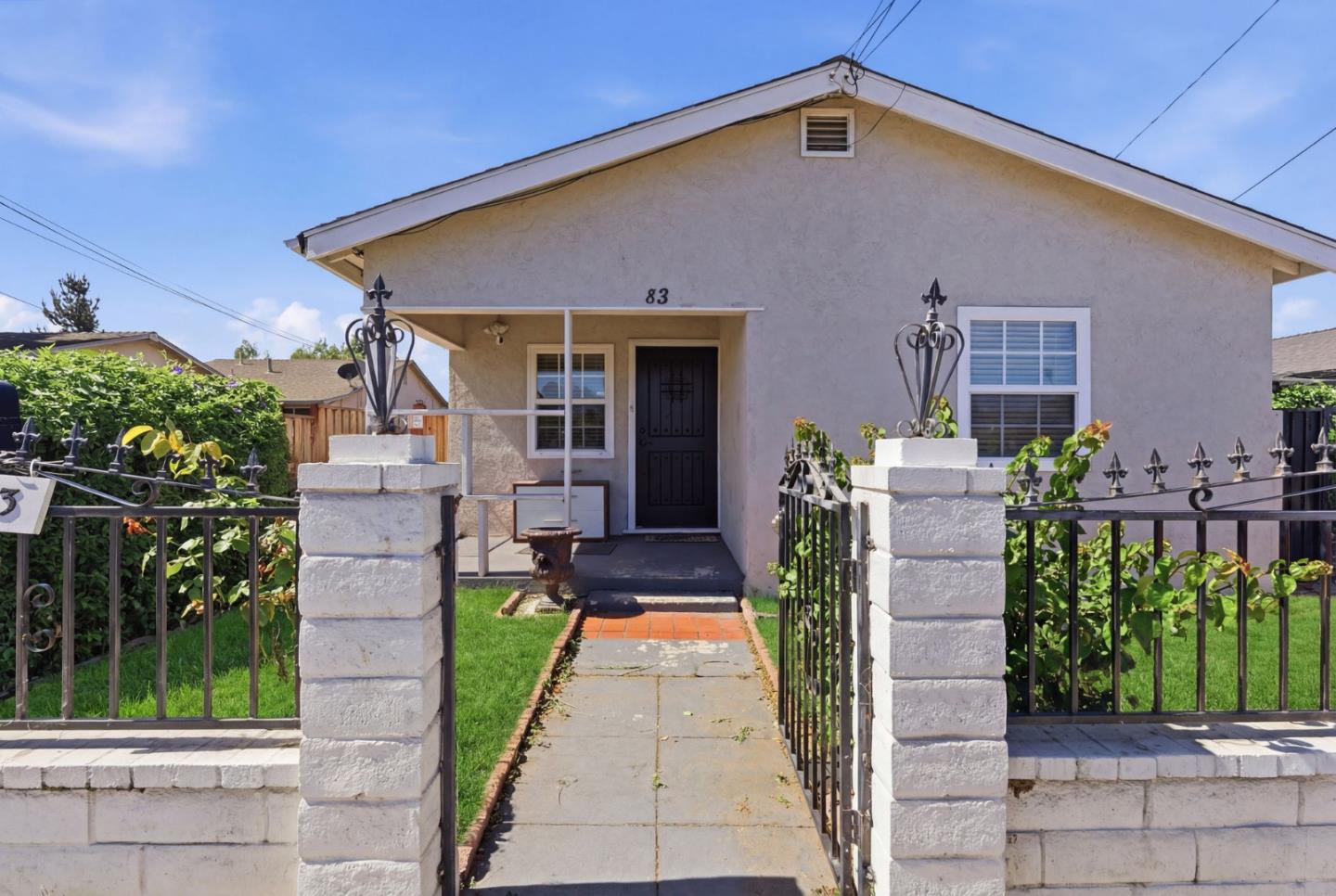83 North King Road San Jose, CA 95116 - Photo 45 of 51 a front view of a house with a yard