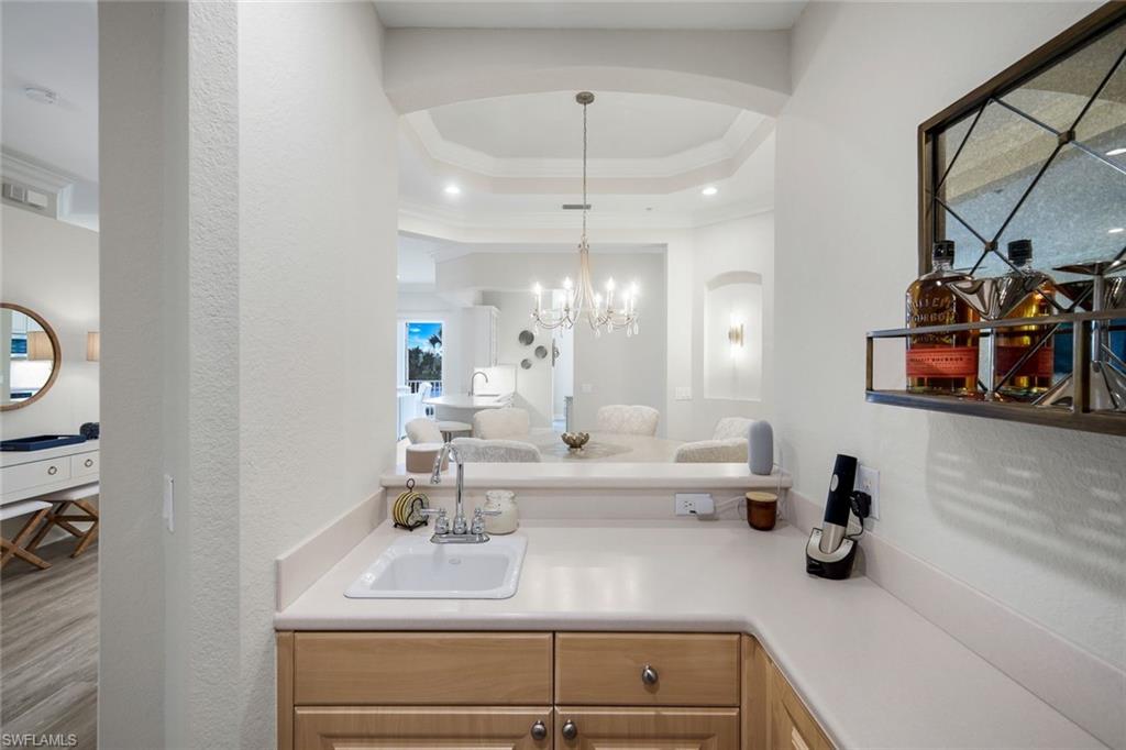 9201 Quartz Lane, Unit 202 Naples, FL 34120 - Photo 11 of 48 a bathroom with a sink double vanity and a mirror