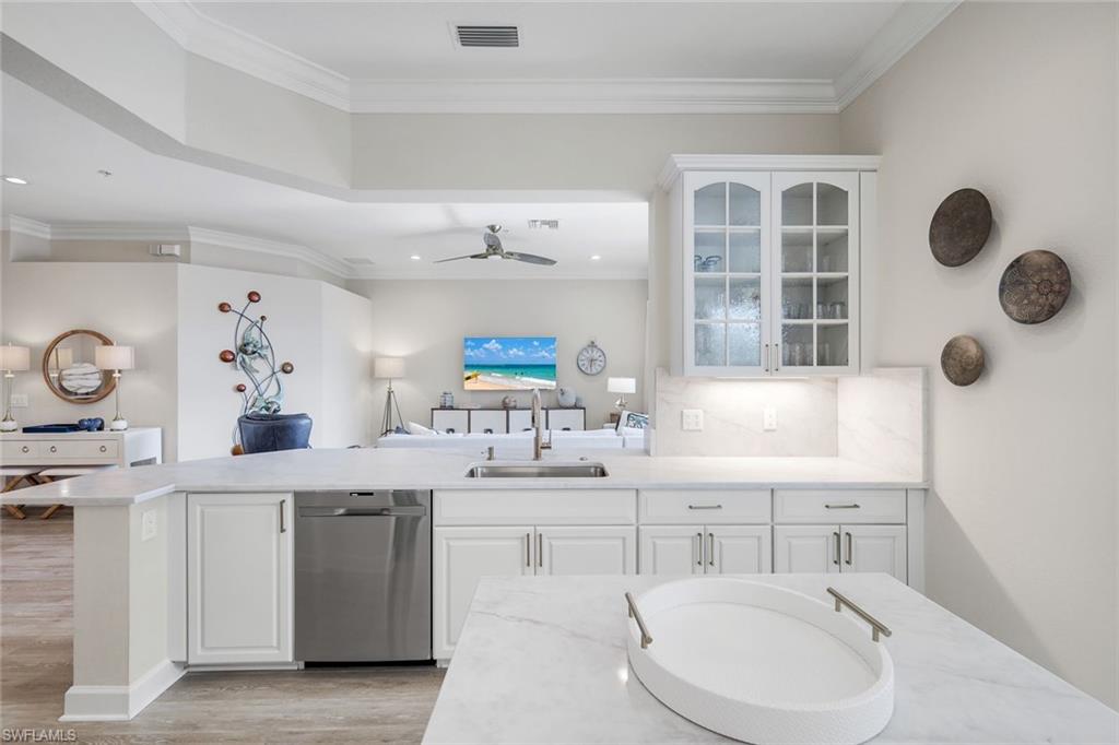 9201 Quartz Lane, Unit 202 Naples, FL 34120 - Photo 14 of 48 a bathroom with a sink and a mirror