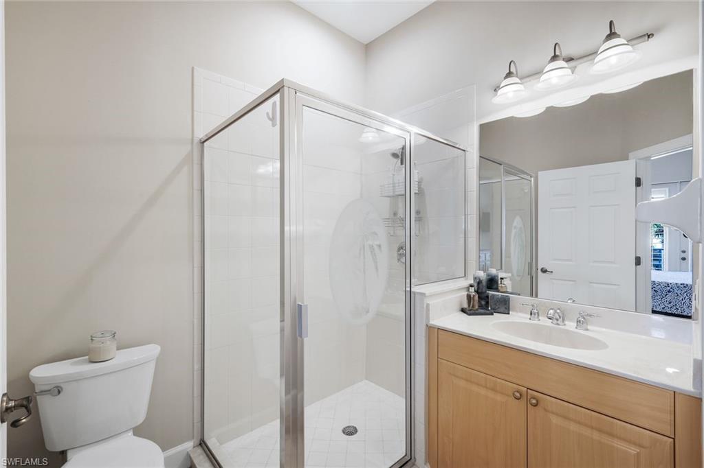 9201 Quartz Lane, Unit 202 Naples, FL 34120 - Photo 24 of 48 a bathroom with a toilet sink and shower