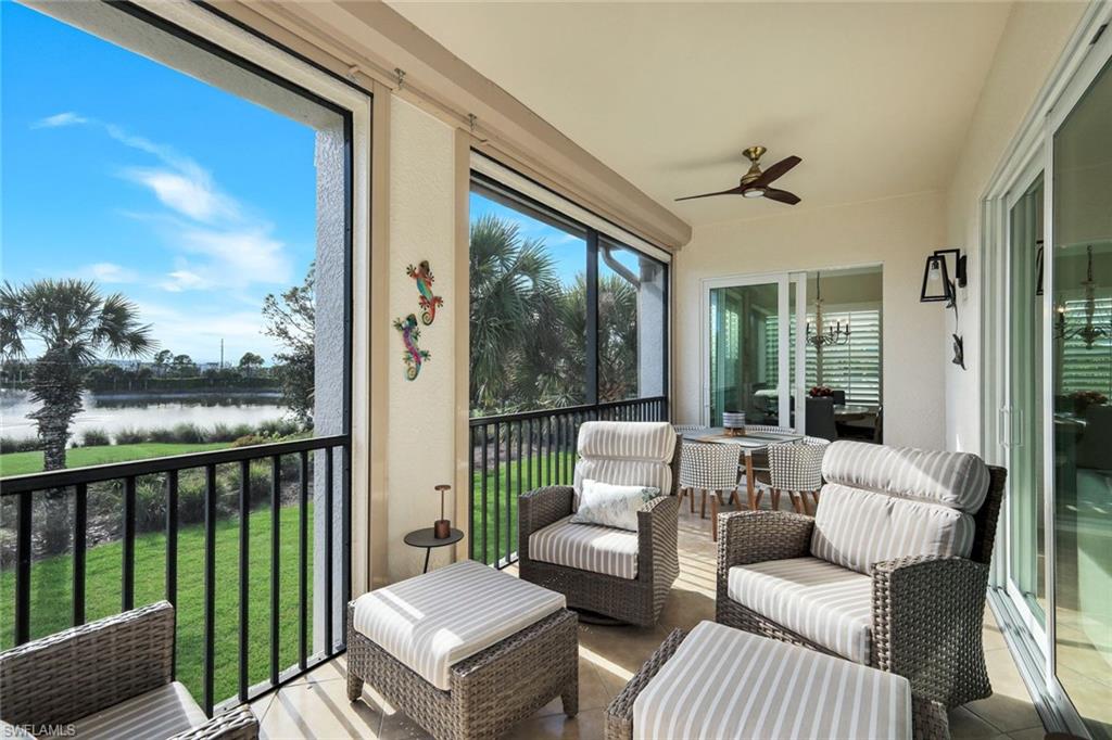 9201 Quartz Lane, Unit 202 Naples, FL 34120 - Photo 30 of 48 a balcony with furniture and a potted plant