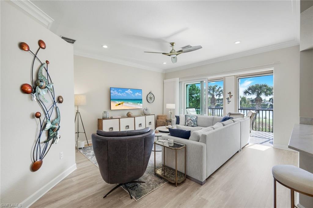 9201 Quartz Lane, Unit 202 Naples, FL 34120 - Photo 7 of 48 a living room with furniture and a window