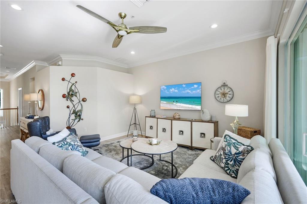 9201 Quartz Lane, Unit 202 Naples, FL 34120 - Photo 8 of 48 a living room with furniture and wooden floor
