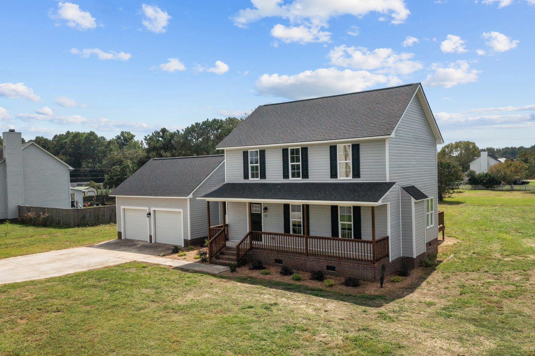 a view of a house with a big yard