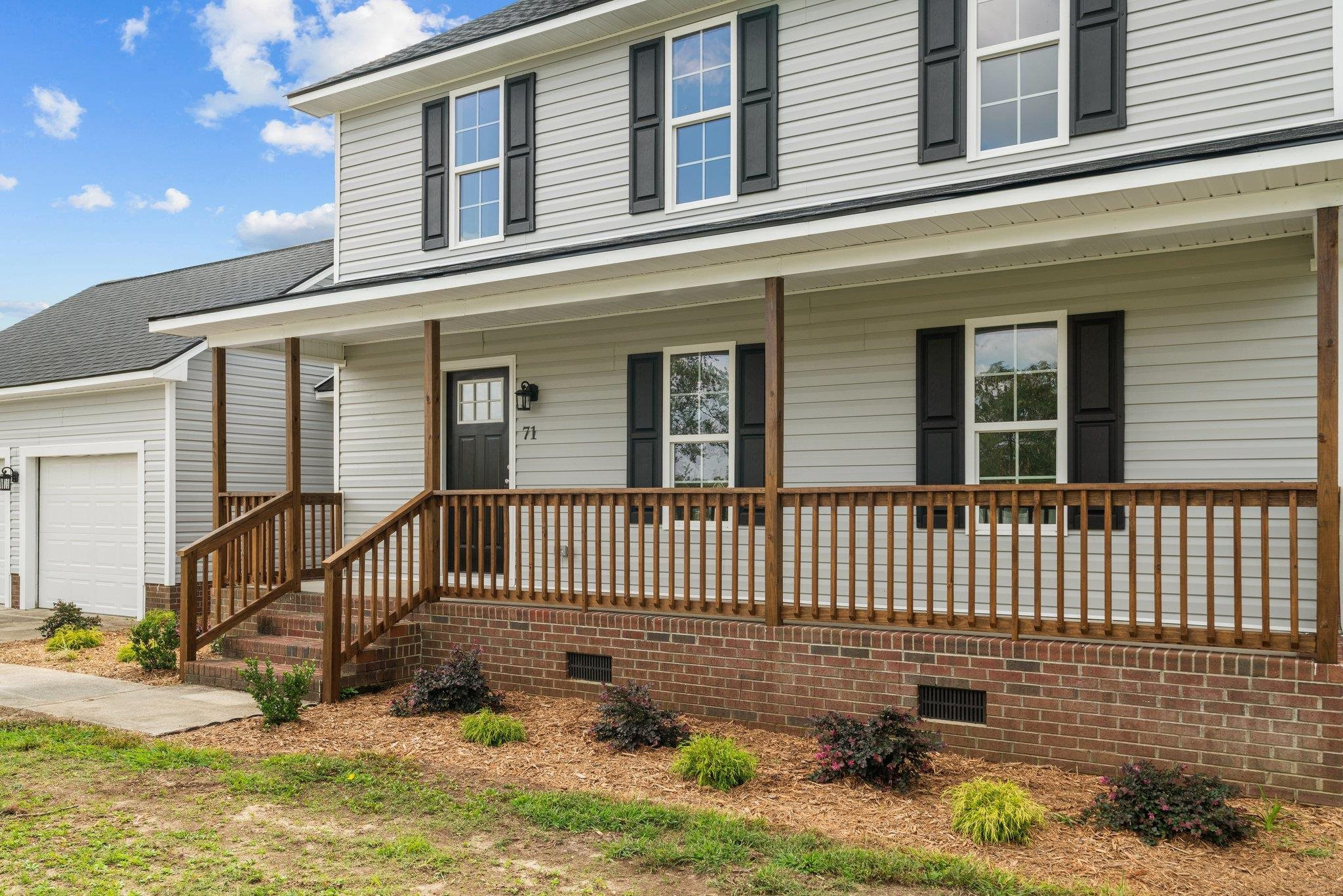 71 Preston Way Lillington, NC 27546 - Photo 15 of 19 a front view of a house with iron fence