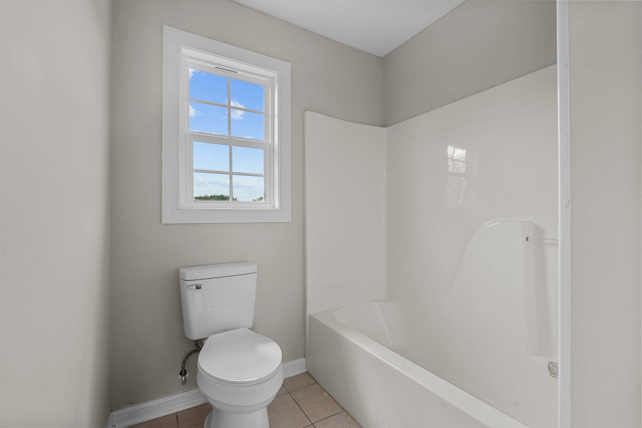 71 Preston Way Lillington, NC 27546 - Photo 10 of 19 a white toilet sitting next to a bath tub
