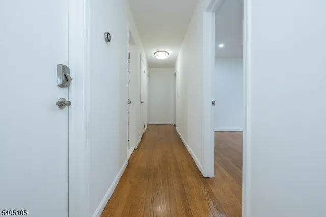 a view of a bathroom from the hallway