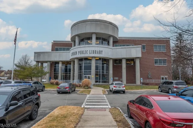 front view of a building with car parked
