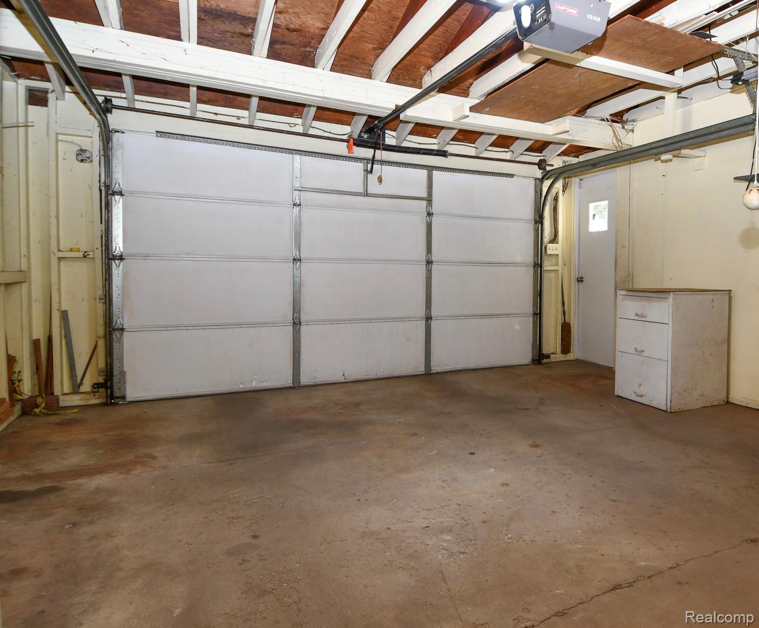 6443 Richfield Road Flint, MI 48506 - Photo 34 of 40 Garage with a garage door opener