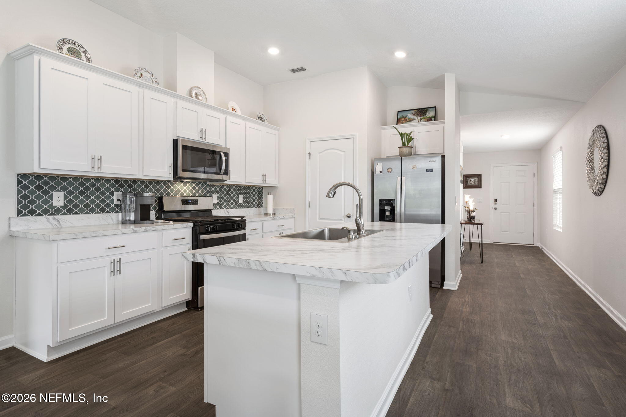 65 Mula Ct Street St. Augustine, FL 32084 - Photo 14 of 38 a kitchen with appliances a sink and cabinets