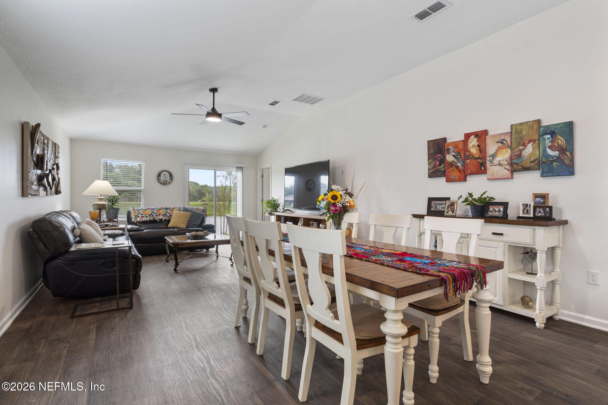 65 Mula Ct Street St. Augustine, FL 32084 - Photo 15 of 38 a view of a dining room with furniture and wooden floor