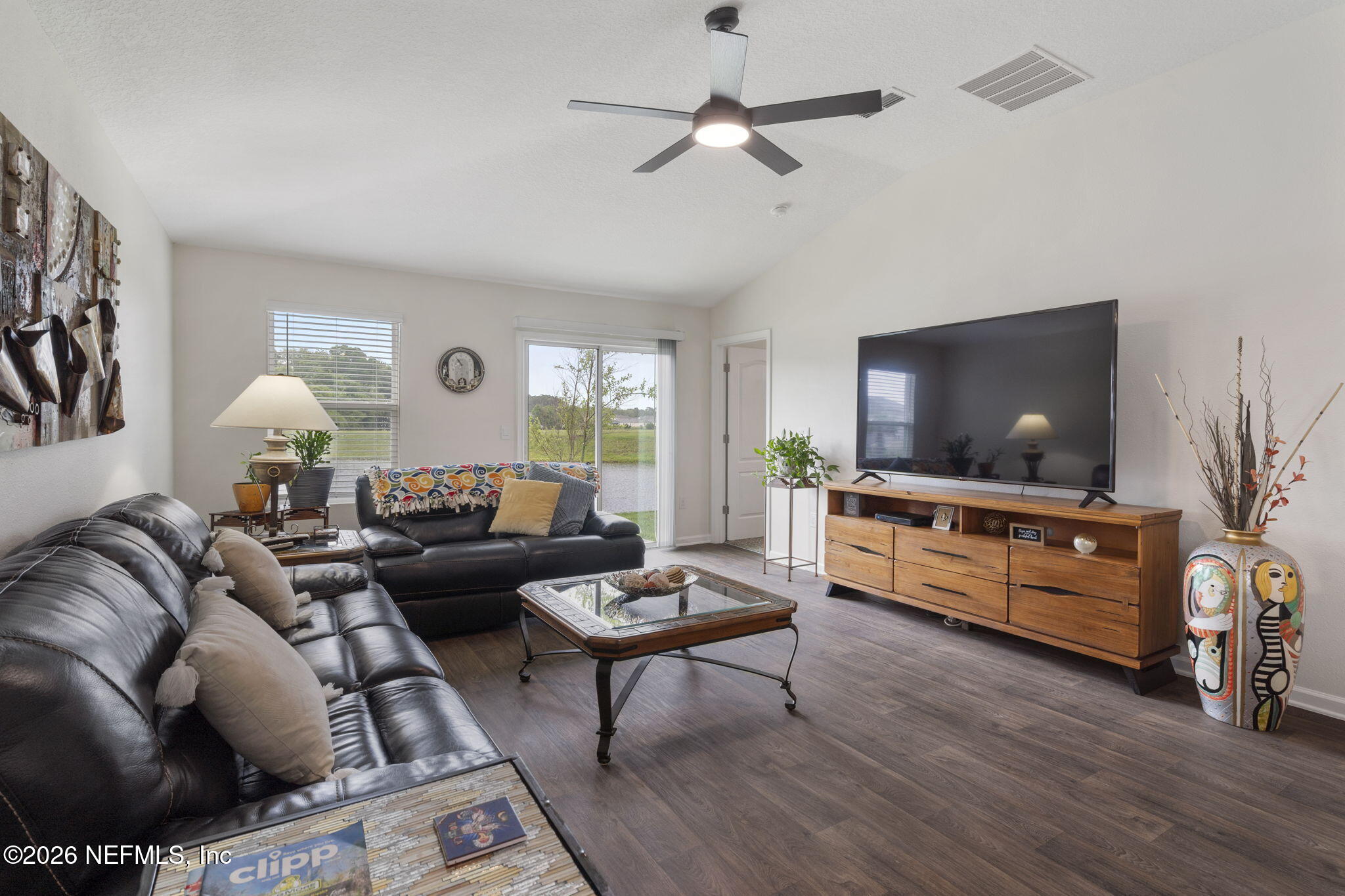 65 Mula Ct Street St. Augustine, FL 32084 - Photo 16 of 38 a living room with furniture and a flat screen tv