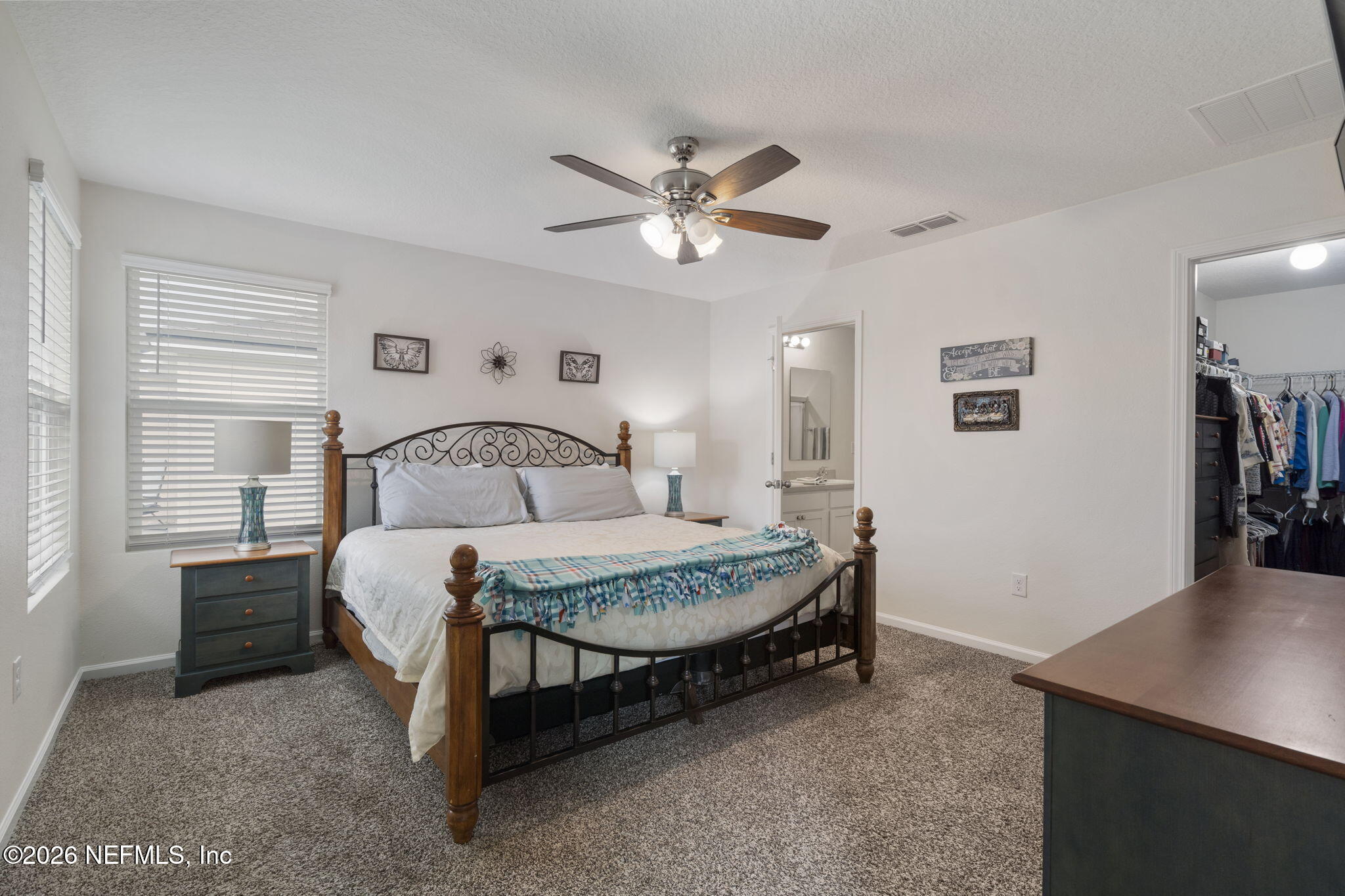 65 Mula Ct Street St. Augustine, FL 32084 - Photo 20 of 38 a bedroom with a bed and a table in it