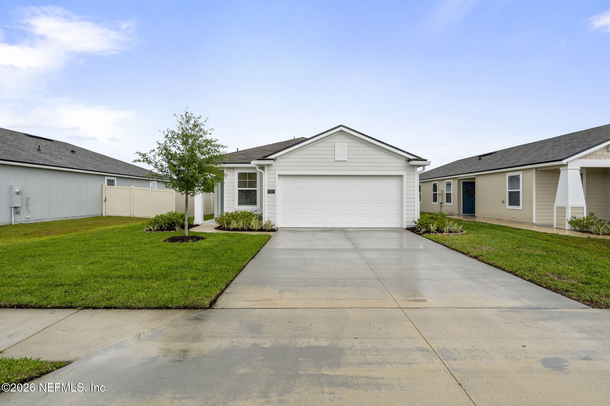 65 Mula Ct Street St. Augustine, FL 32084 - Photo 2 of 38 a view of a house with a yard and garage