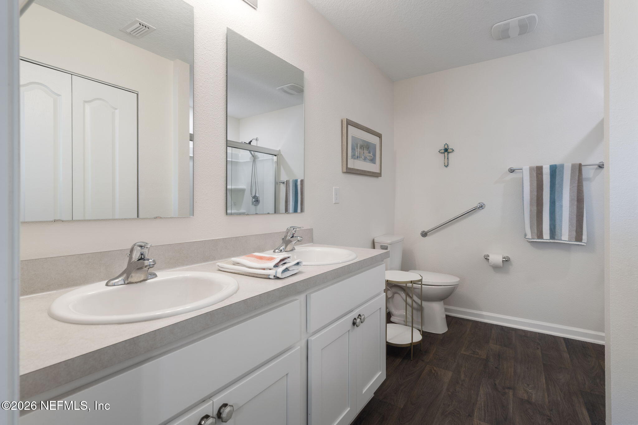 65 Mula Ct Street St. Augustine, FL 32084 - Photo 22 of 38 a bathroom with a toilet sink and mirror