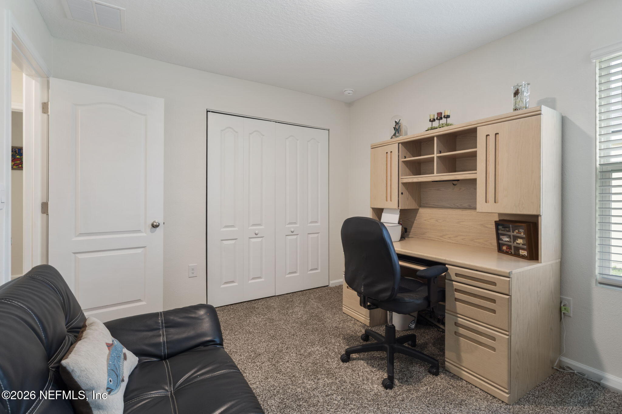 65 Mula Ct Street St. Augustine, FL 32084 - Photo 26 of 38 a view of a livingroom with workspace and a couch