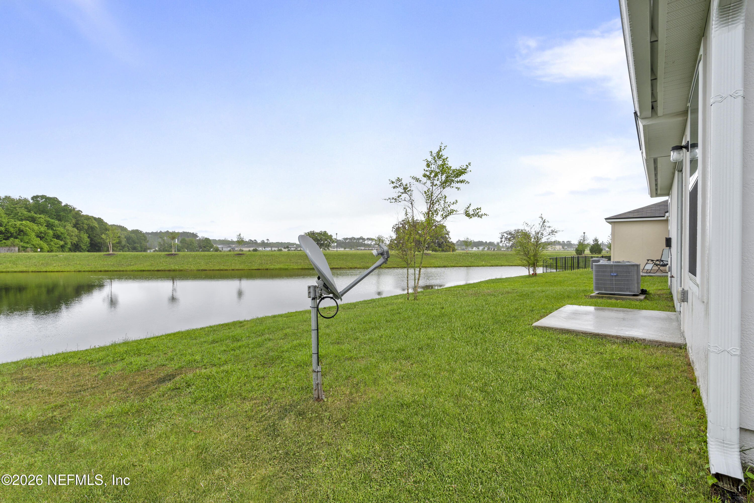 65 Mula Ct Street St. Augustine, FL 32084 - Photo 5 of 38 a view of a lake with a yard