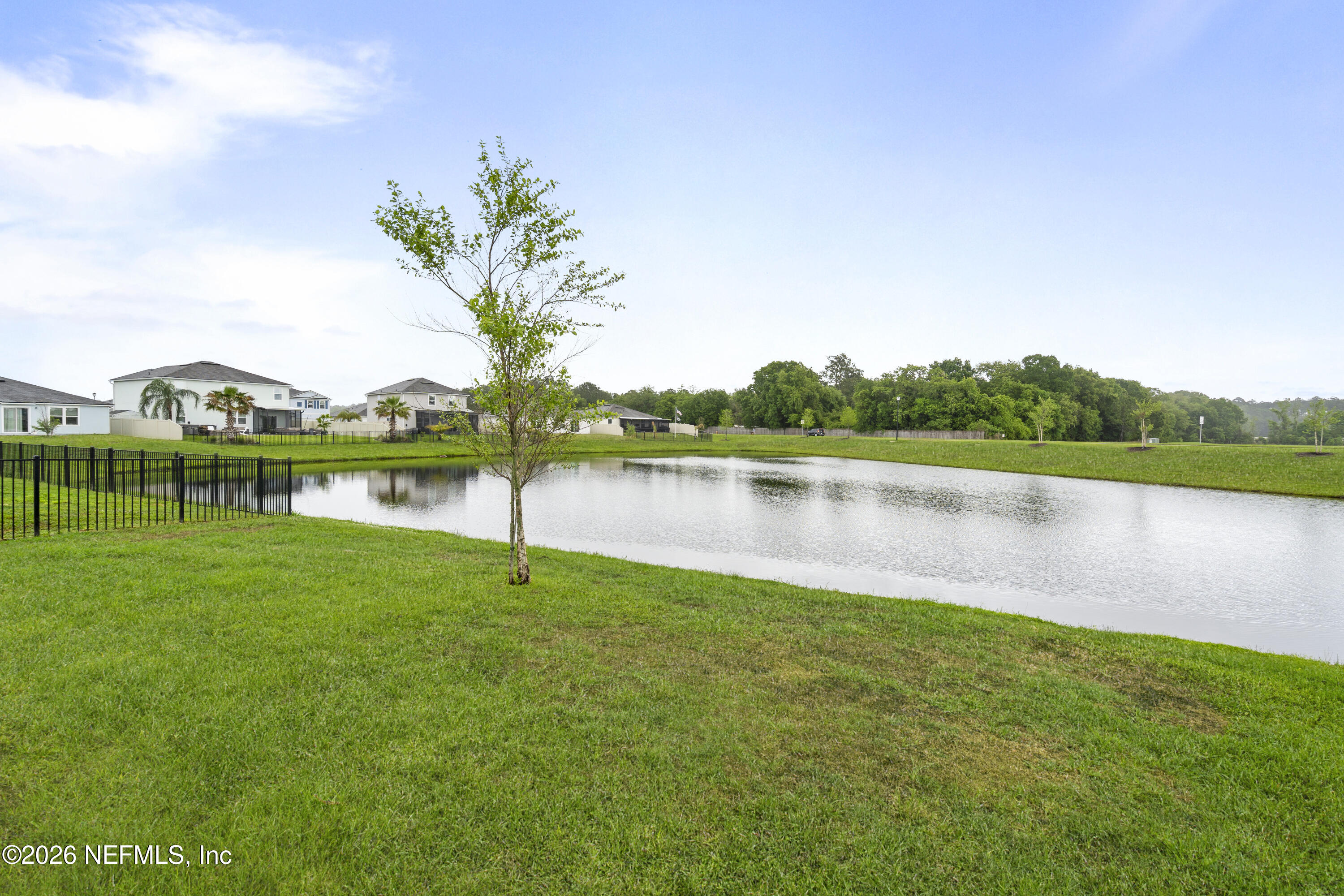65 Mula Ct Street St. Augustine, FL 32084 - Photo 8 of 38 a view of a lake with houses in the background