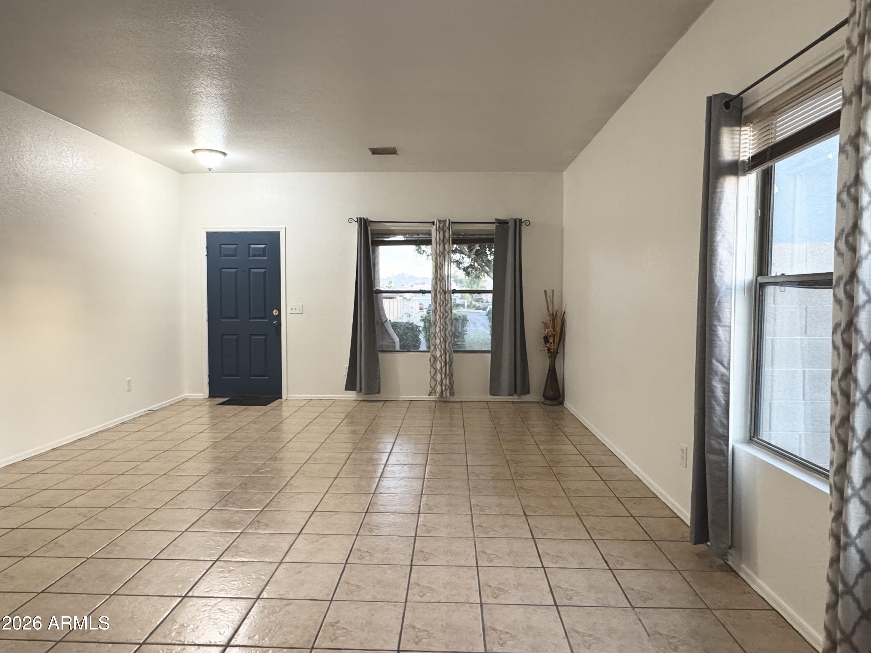 9730 West Payson Road Tolleson, AZ 85353 - Photo 46 of 57 a view of an empty room and window
