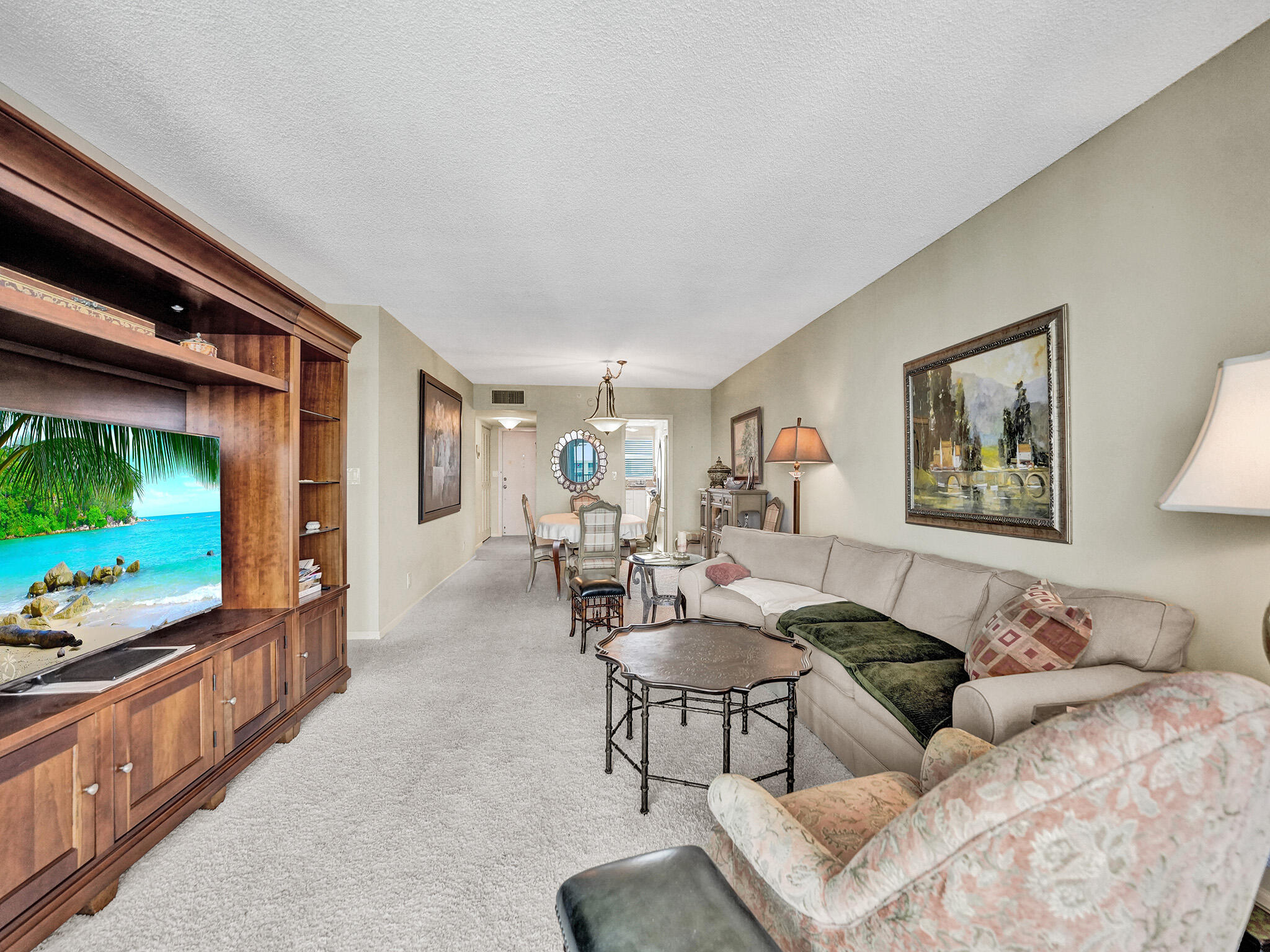 3300 South Ocean Boulevard, Unit 1021C Highland Beach, FL 33487 - Photo 20 of 45 a living room with furniture and a flat screen tv