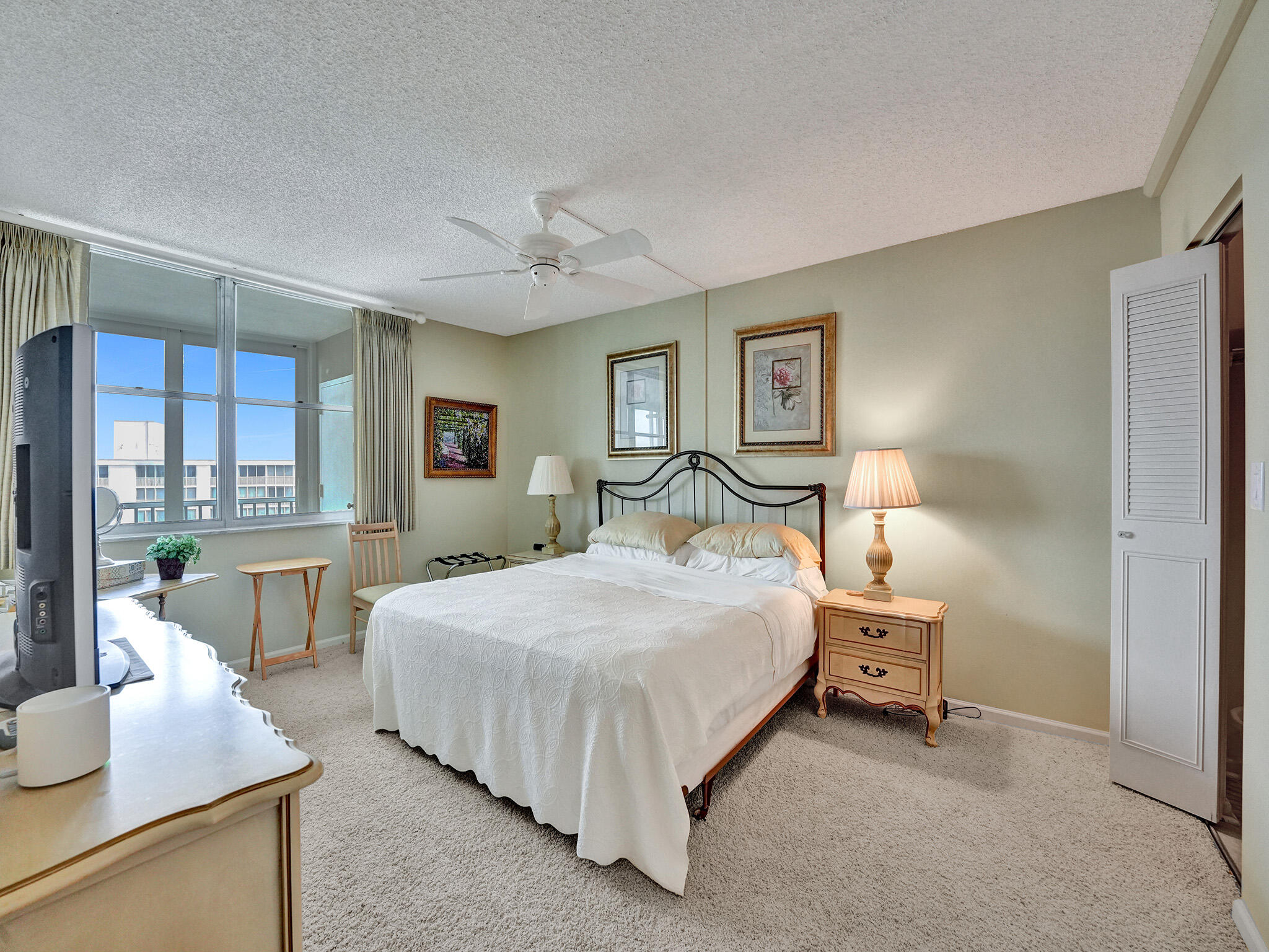 3300 South Ocean Boulevard, Unit 1021C Highland Beach, FL 33487 - Photo 24 of 45 a bedroom with a bed and large windows
