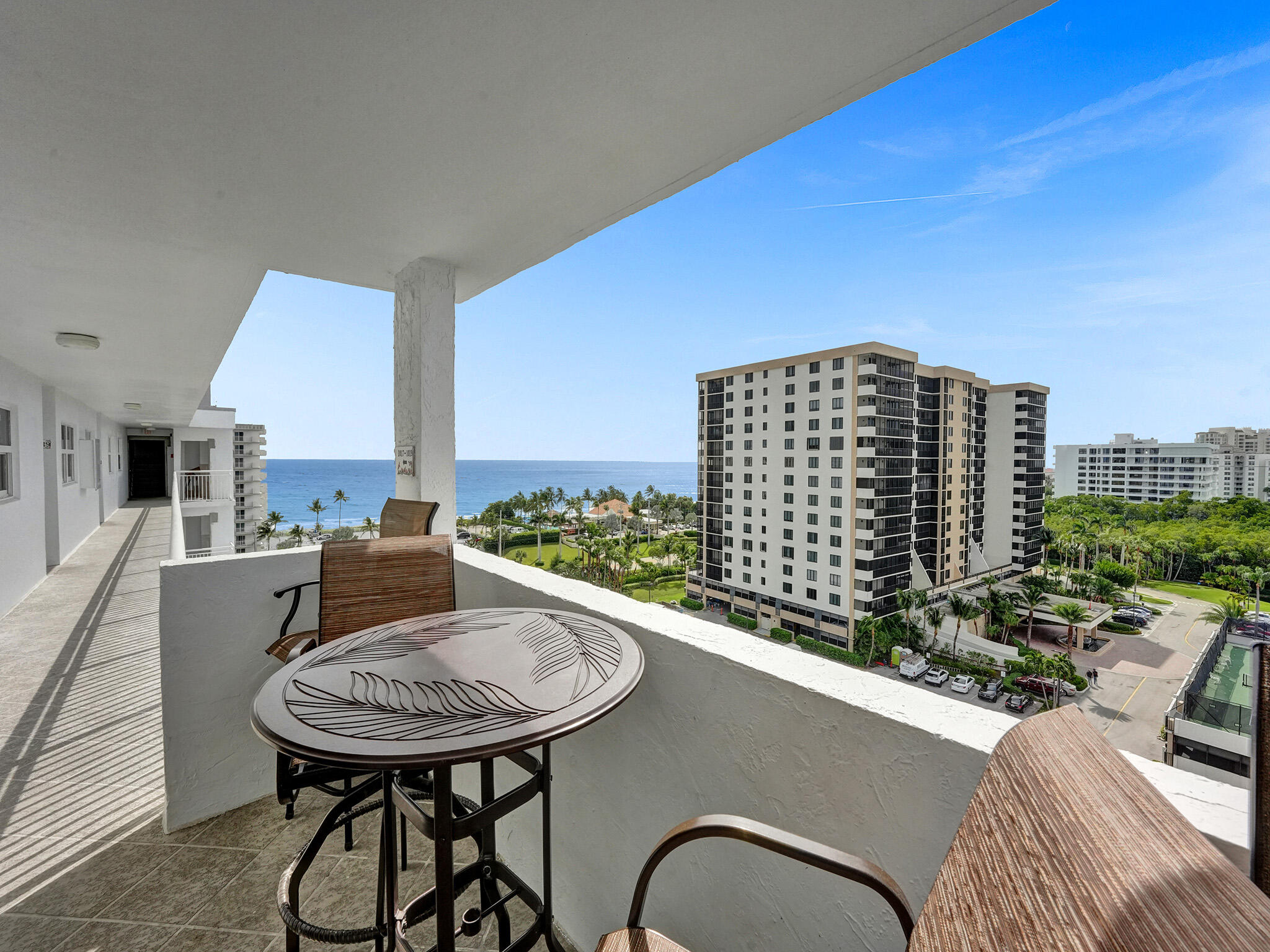3300 South Ocean Boulevard, Unit 1021C Highland Beach, FL 33487 - Photo 28 of 45 a view of a balcony with a table and chairs