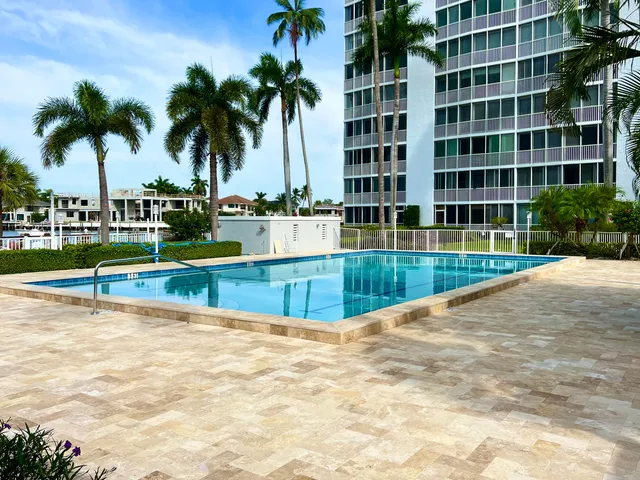 a view of a swimming pool with a lounge chairs